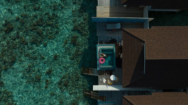 Luminous Maldives Water Villas Above Turquoise Coral Lagoon