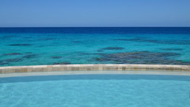 Scenic Coastal Resorts With Infinity Pools Facing Golden Shores